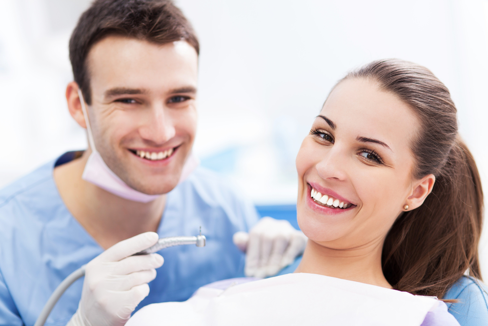 Male,Dentist,And,Woman,In,Dentistã¢â?â?s,Office